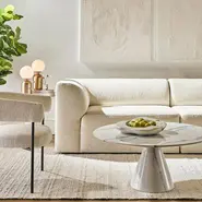 beige sofa with lounge chair and coffee table